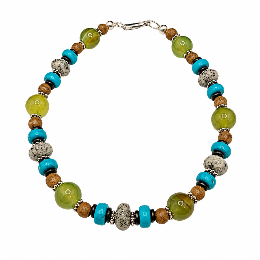 Homeward Bound bracelet with turquoise, green and earth-tone beads and silver clasp on white background